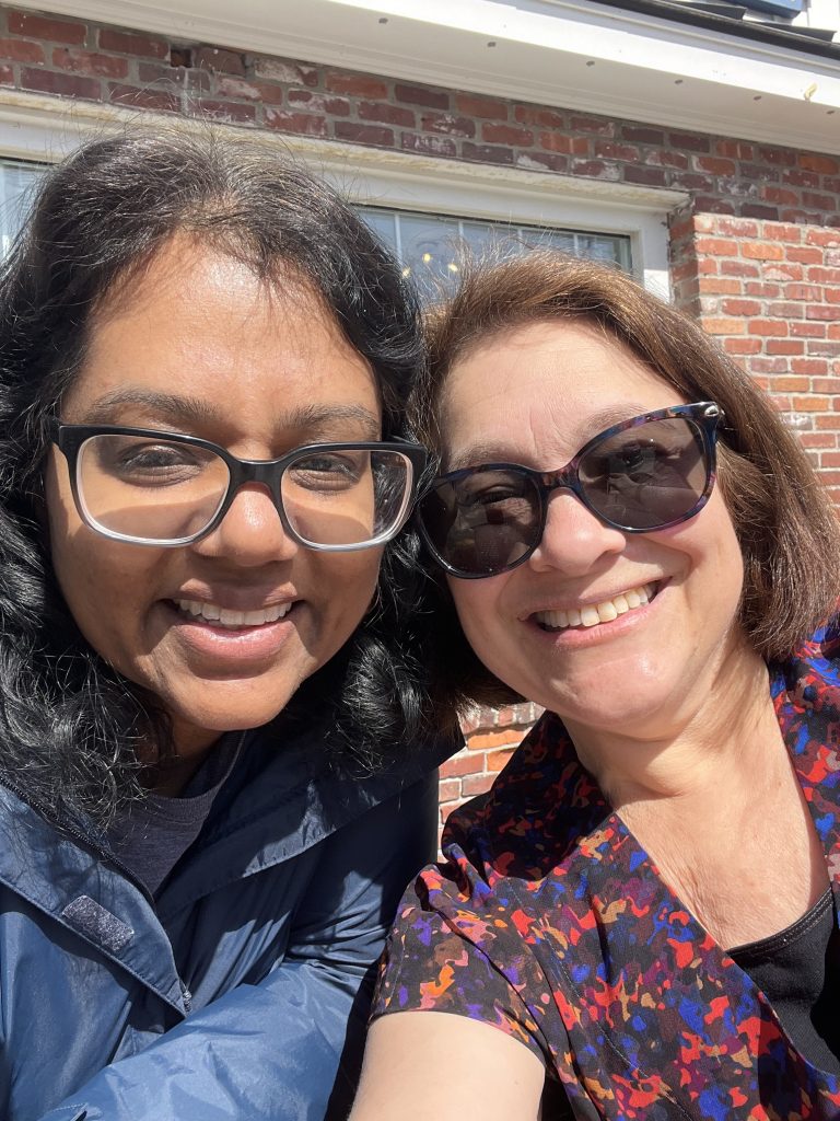 Two moms who met through the disability community and became friends. They are smiling for a selfie.